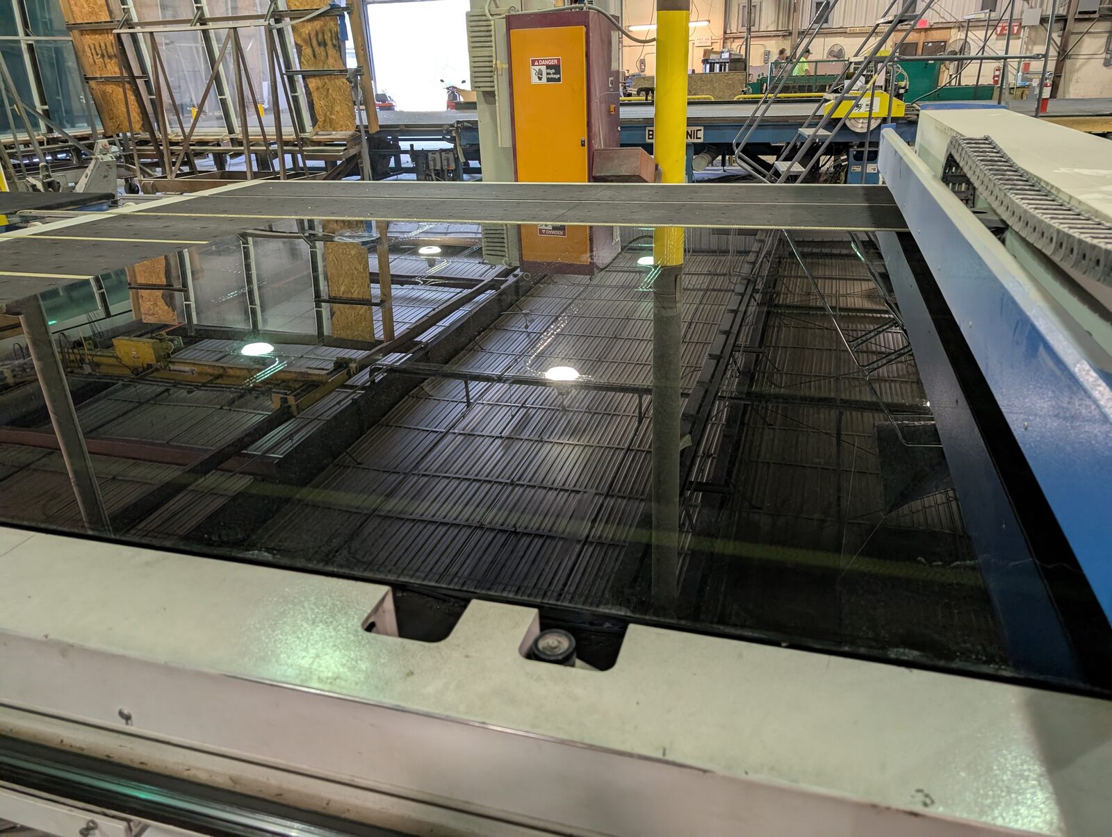 Glass lite on the CNC cutting table at Tempered Edge